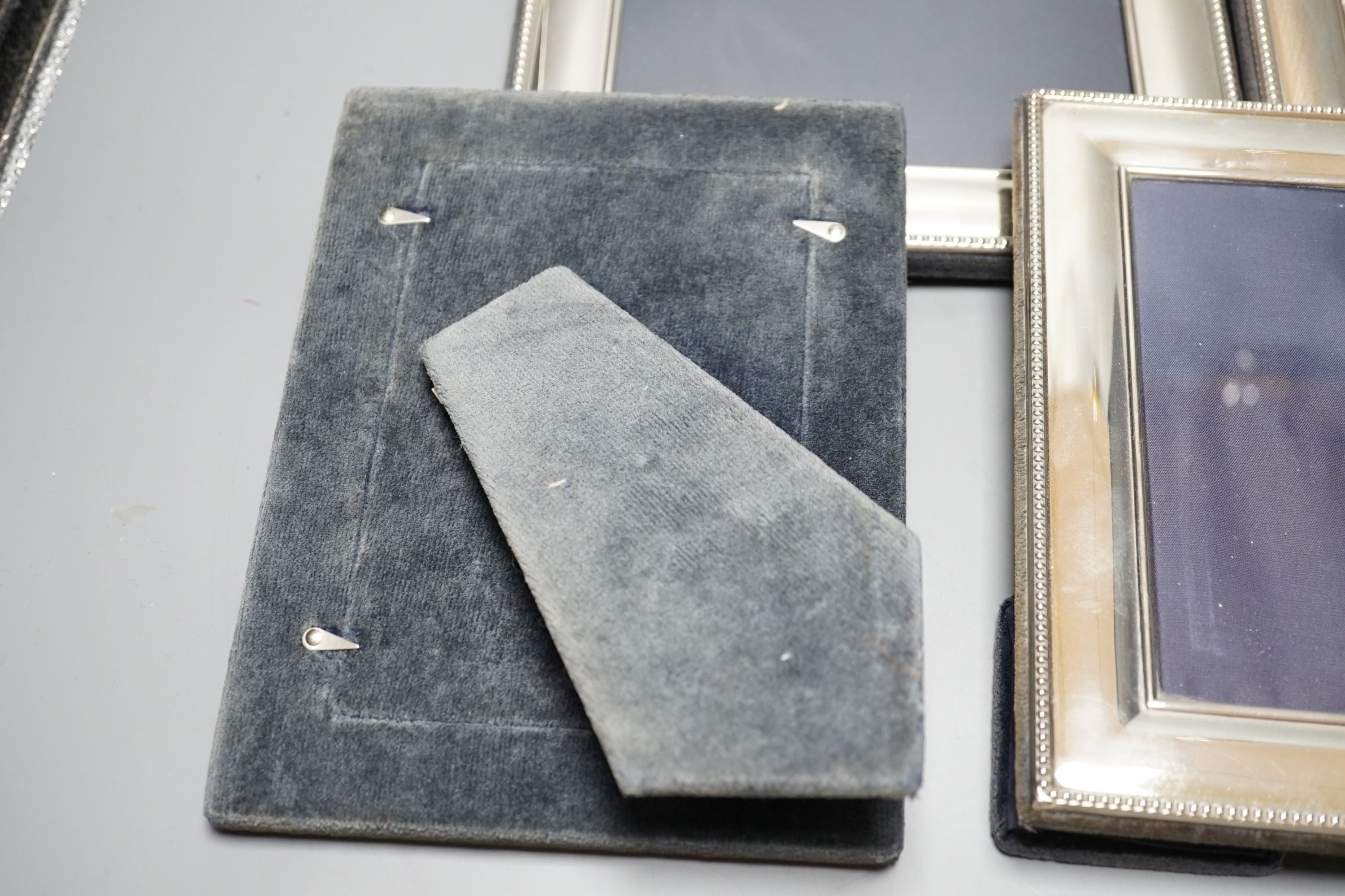 A modern pair of silver mounted photograph frames, Carrs of Sheffield, 2001, 26cm, and a set of three smaller frames, same maker, 2000, 20.2cm